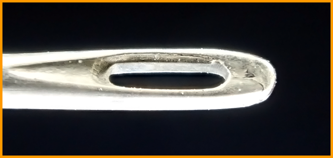 Sewing needle eye / Ушко швейной иглы