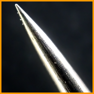 The point of the sewing needle / Острие  швейной иглы